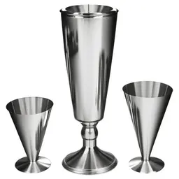 Cocktail shaker and martini glass, stainless steel shaker, three-piece design, V-shaped martini glass, olives on cocktail pick, clear liquid in glass in a sketch